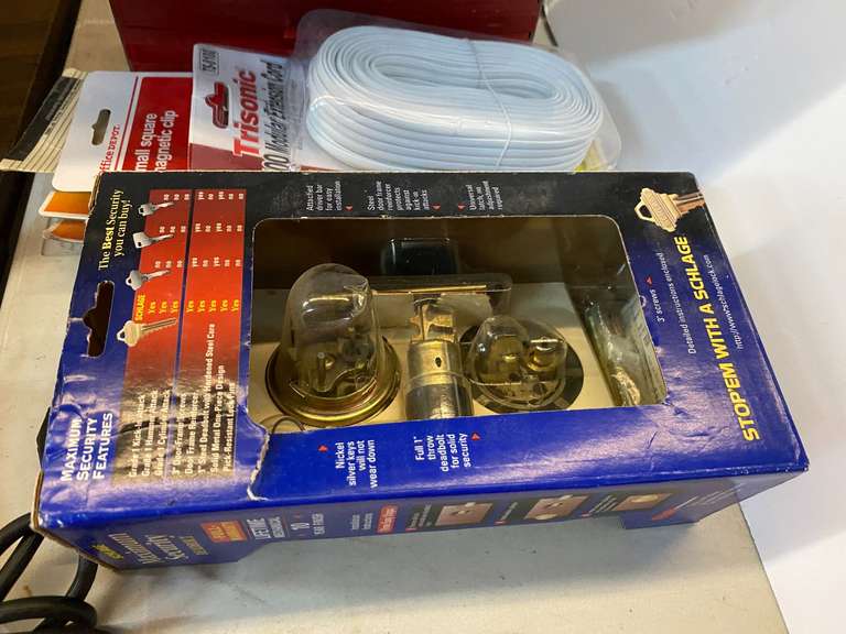 Assorted items to include Schlage security deadbolts, phone cord, multipurpose scissors, assorted electrical parts, and more. See pictures for details. image