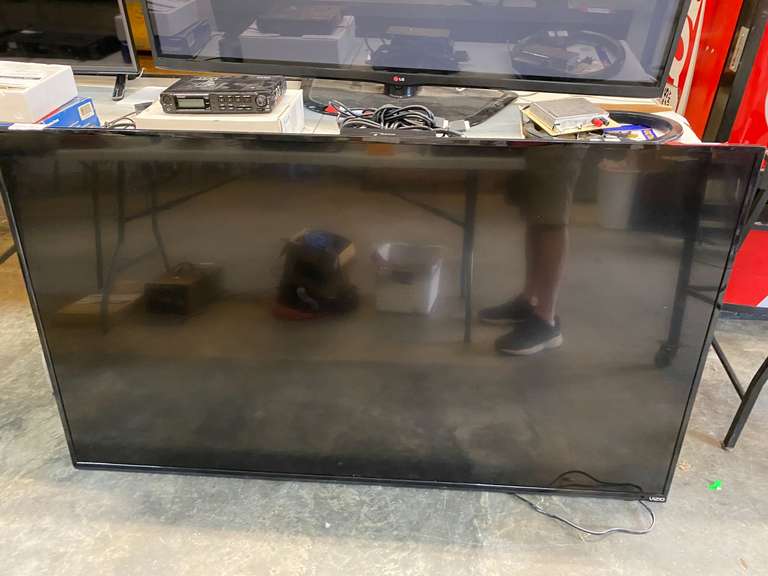 Vizio 65 inch TV, this piece powers up but the screen is cracked, see pictures for details. image