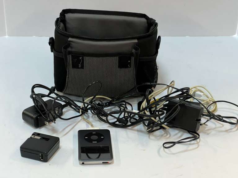 Camera bag with iPod and assorted charging cords, see pictures for details. image
