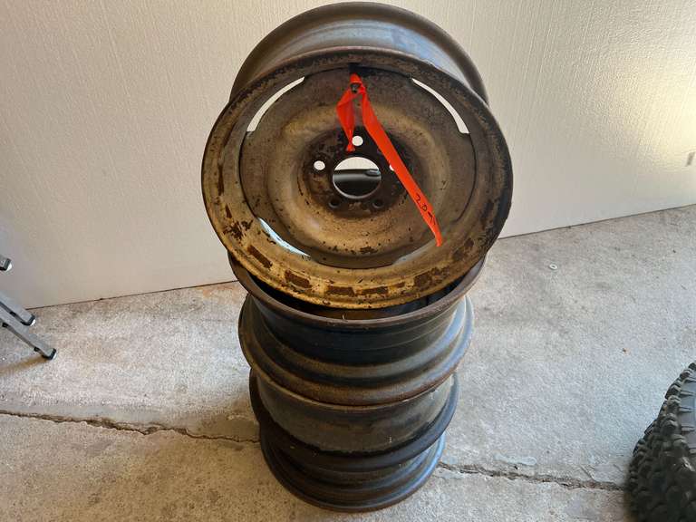 Five hole tire rims, set of four, see pictures for details. image