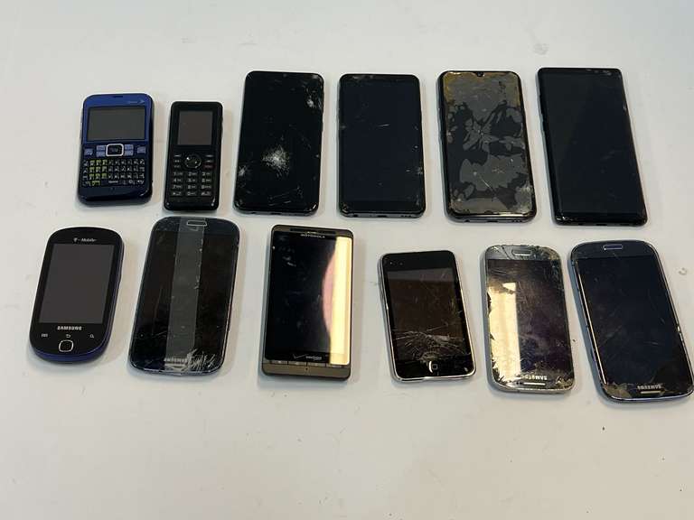 Cell phone assortment, some with cracked screens, tub is not included, see pictures for details. image