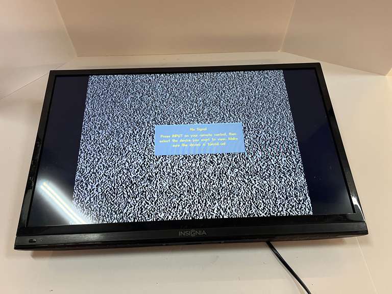 Insignia 28” TV, powers up, see pictures for details. image