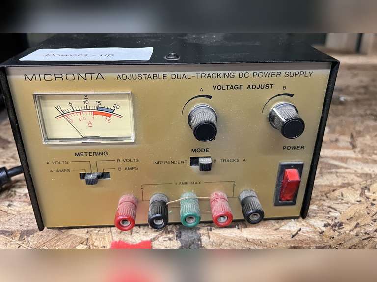 Micronta adjustable dual tracking DC power supply, powers up, working condition unknown, see pictures for details. image