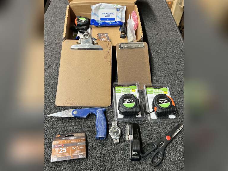 Assortment of small hand tools and office supplies to include tape measures, clipboards, stapler, trowels, and more. See pictures or details. image