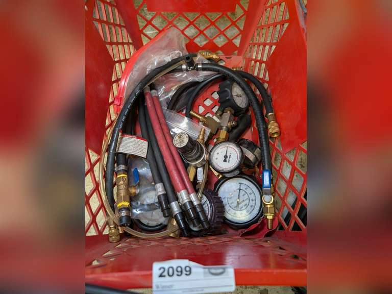 STAPLES BASKET FILLED WITH PRESSURE TESTERS INCLUDING YAMAHA SPECIALTY TESTERS, HOSES, AND MORE image