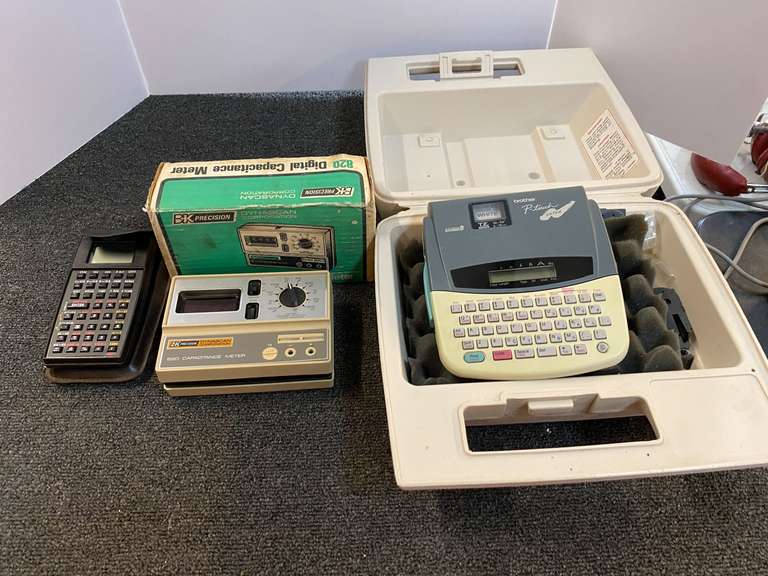 Brother P-touch Extra Electronic Labeling System PT-310, comes with storage/carrying box, working condition unknown, also includes Navtronic Explorer Flight Calculator, and a BK Precision 820 capacitance meter, working condition unknown, see pictures for details. image
