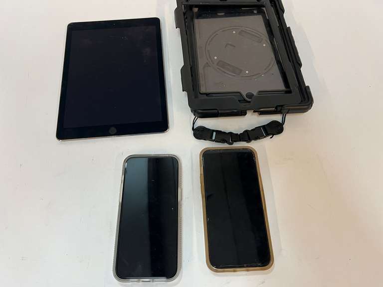 iPad, has cracked screen, also includes two cell phones, one with a cracked screen, see pictures for details. image