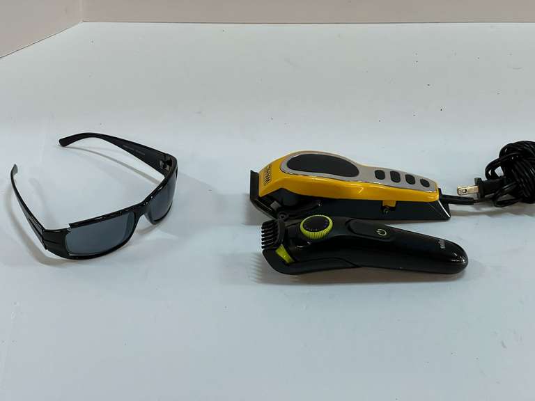 Wahl electric trimmer, also includes a Braun battery powered trimmer, no charger but powers up, and a pair of Kenneth Cole sunglasses, see pictures for details. image