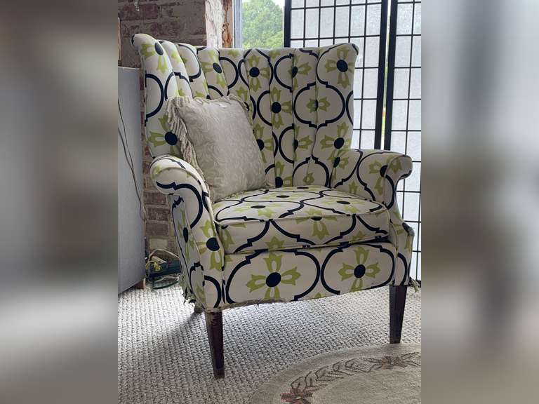 UPHOLSTERED BUTTERFLY WING CHAIR (NEEDS NEW SKIRTING AT BOTTOM) WITH CREAM TAPESTRY FRINGED THROW PILLOW 39" TALL X 35" WIDE X 33" DEEP image