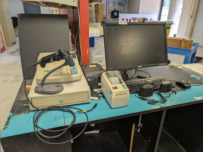 RETAIL COMPUTER PERIPHERALS INCLUDING DELL 22-IN FLAT SCREEN MONITOR, KEYBOARD, MOUSE, AMAZONBASICS SPEAKERS, LP 2824 PLUS PLUS LABEL PRINTER, STAR TSP100 ECO FUTURE PRINT RECEIPT PRINTER, HONEYWELL BARCODE SCANNER, AND ROYAL 120 NT CASH REGISTER image
