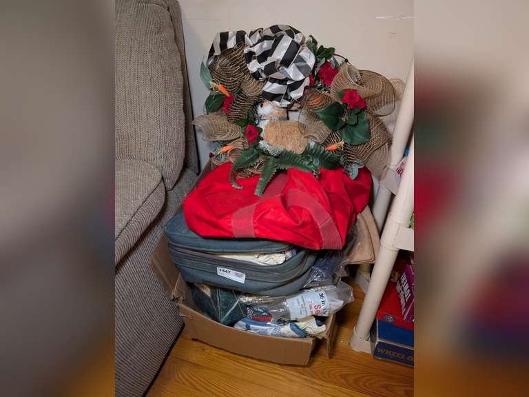 MYSTERY BOX LOT WITH HANDMADE RABBIT WREATH, FACTORY SEALED TABLECLOTHS, AND MORE BENEATH image