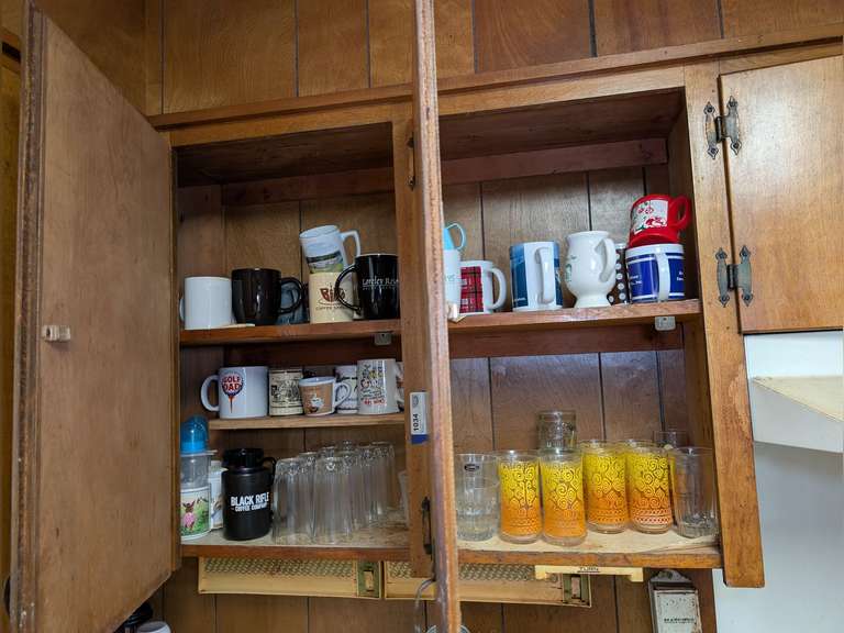 ALL DRINK WEAR AN UPPER CABINET MARKED 1034 INCLUDING VINTAGE ICED TEA GLASSES, CRYSTAL BAR GLASSES, AND MORE image