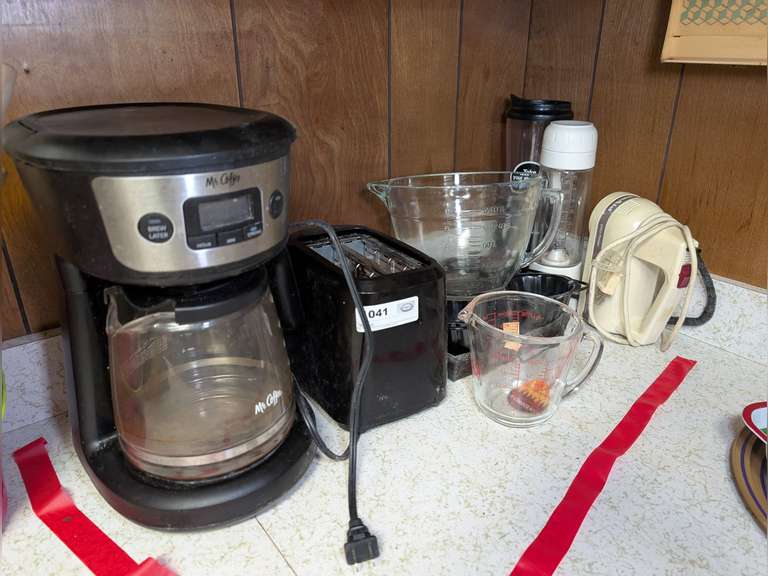 APPLIANCES AND MORE IN COUNTERTOP CORNER AREA MARKED 1041 INCLUDING MR. COFFEE, TOASTER, GLASS MEASURING CUPS, AND MORE image