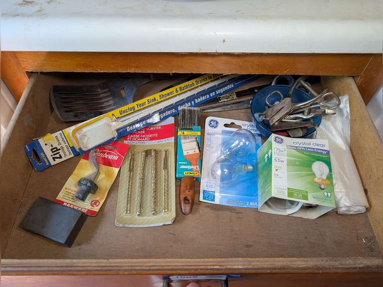 CONTENTS OF DRAWER MARKED 1005 INCLUDING NUT / LOBSTER CRACKING SET IN ORIGINAL PACKAGE, GRILLING UTENSILS, HONING STONE, LIGHT BULBS, AND MORE image