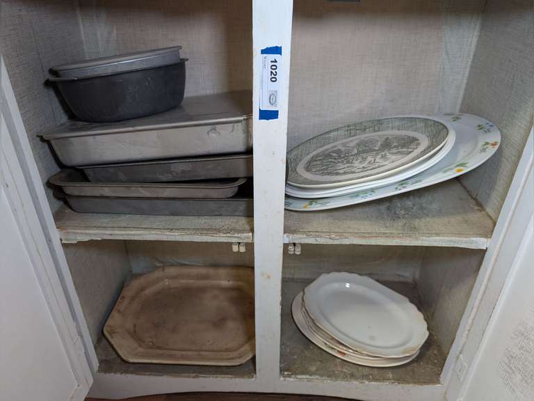 BAKING PANS AND VINTAGE / ANTIQUE PLATTERS IN LOW CABINET MARKED 1030 image