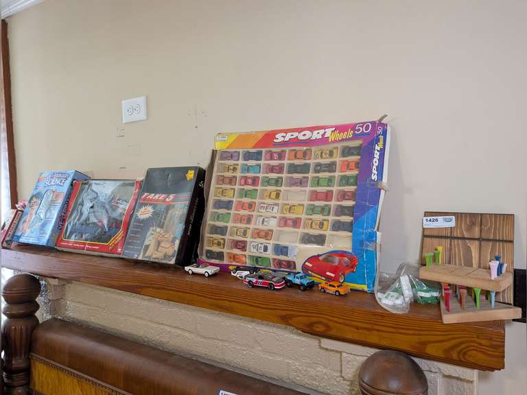 VINTAGE GAMES, TOYS, AND MORE ON LIVING ROOM FIREPLACE MANTEL image
