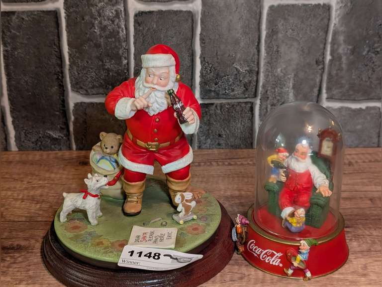 PAIR OF SIGNED AND NUMBERED COCA-COLA SANTA CLAUS FIGURINES image