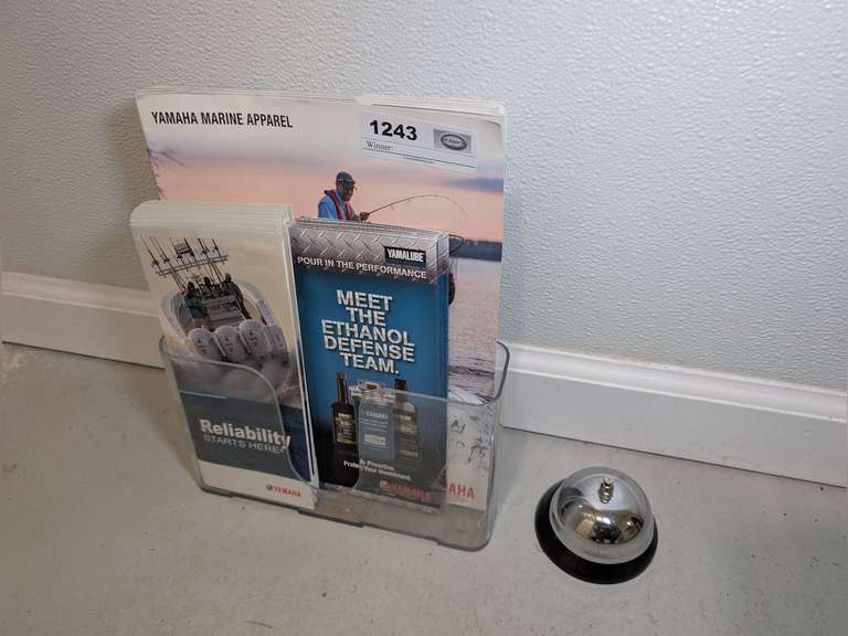 CLERK BELL AND BROCHURE STAND WITH BROCHURES image