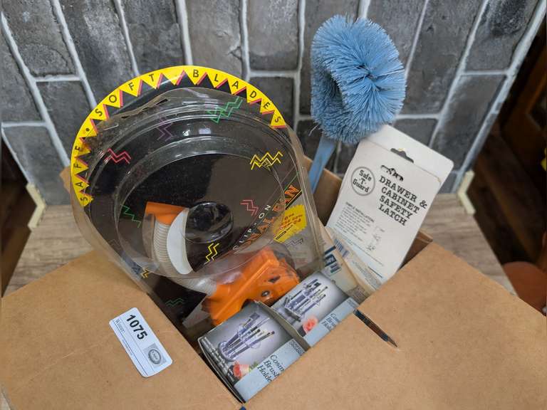 BOX LOT INCLUDING TWO INTERNATIONAL CHRISTMAS CHAMBERSTICKS IN ORIGINAL BOXES, CLIP-ON PERSONAL FAN, COSMETIC BRUSHES HOLDERS IN ORIGINAL BOXES, BABY PINS IN ORIGINAL PACKAGES, AND MORE image