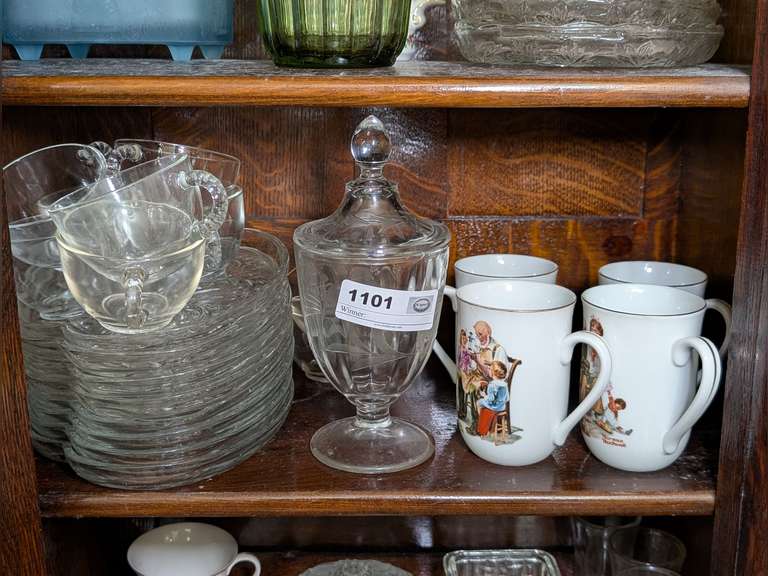 VINTAGE GLASS AND PORCELAIN ON SHELF MARKED 1101 INCLUDING LUNCHEON PLATES WITH MUGS, NORMAN ROCKWELL MUGS, AND MORE image