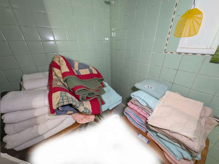 ALL TOWELS AND VINTAGE QUILT IN BATHTUB AREA MARKED 1325 image