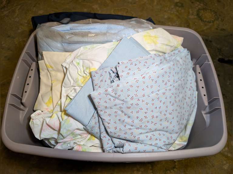 STORAGE TUB WITH GARMENT BAG AND BED LINENS image