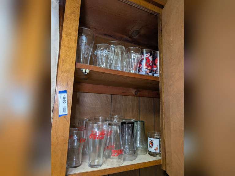 ALL COLLECTIBLE COCA-COLA AND NORMAN ROCKWELL GLASSWARE IN UPPER CABINET MARKED 1040 image