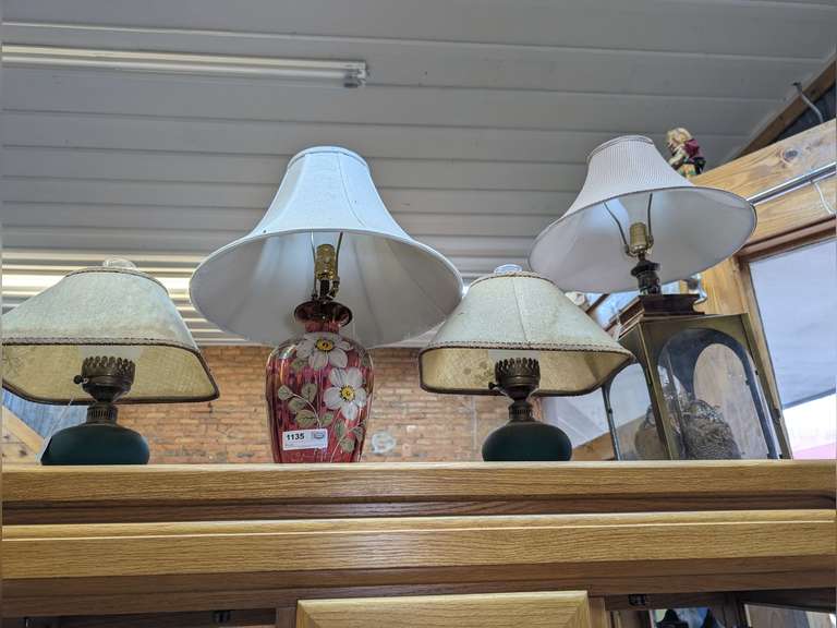 FOUR VINTAGE DECORATIVE LAMPS ON TOP OF CABINET image
