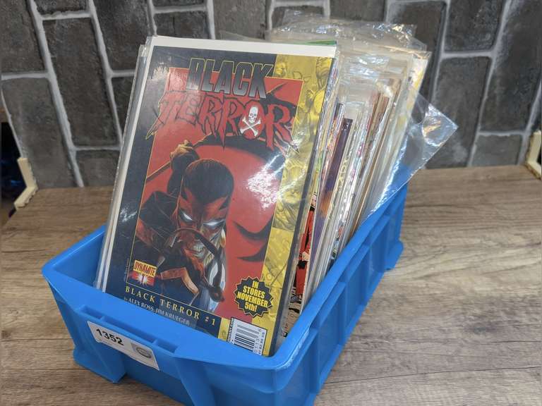 SMALL TUB FILLED WITH COMIC BOOKS image