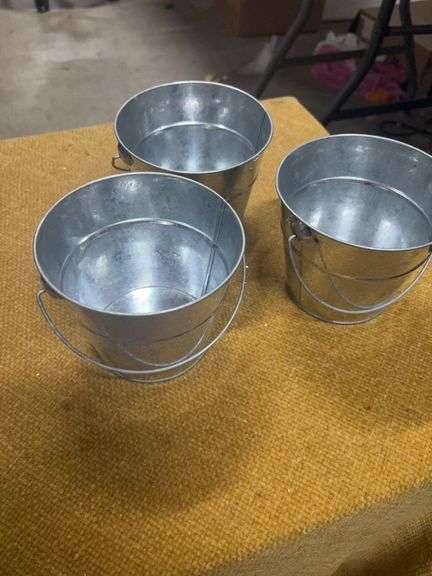 THREE METAL DECORATIVE BUCKETS image