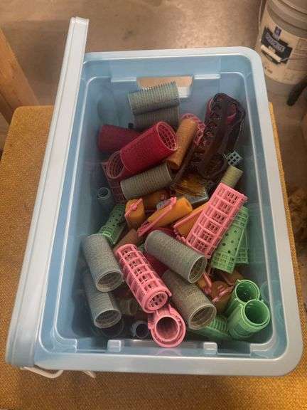 BLUE RUBBER MAID CONTAINER WITH HAIR CURLERS image