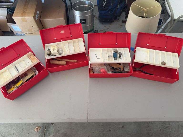 Four Red Toolboxes with Various Contents image