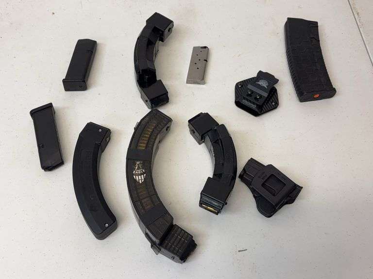 Assorted Firearm Magazines and Sig Sauer Holster image