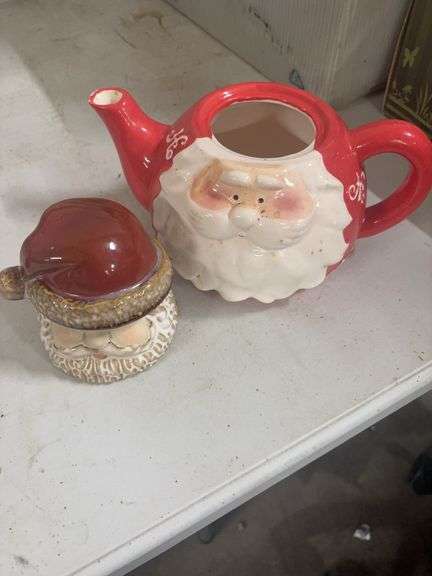 TWO CERAMIC SANTAS. image