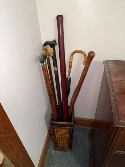 Collection of Walking Sticks and Umbrella in Bamboo Stand