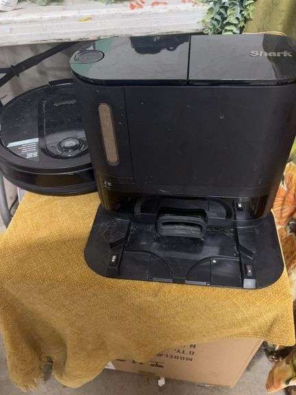 SHARK VACUUM AND HOLDING CONTAINER.  WORKS BUT IS MISSING ONE OF THE BRUSHES THAT IS NEEDED FOR IT TO RUN PROPERLY.  CAN BE USED FOR PARTS image