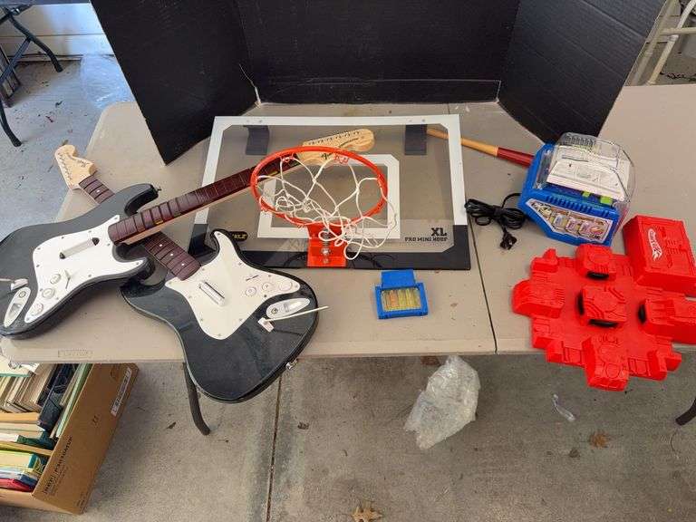 Guitar Hero Guitar, Crayola Crayon Maker, and SKLZ Pro Mini Hoop image