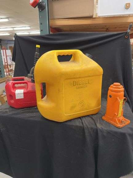 Lot of Gasoline and Diesel Fuel Cans with Hydraulic Jack image