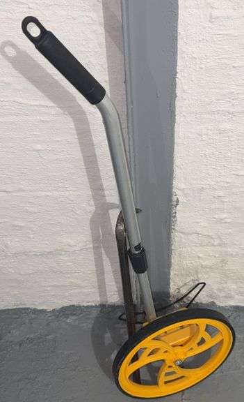 Measuring Wheel and Crowbar image