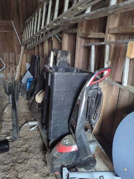 Assorted Items: Tires, Bissell Carpet Cleaner, Container image