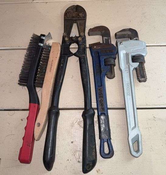 Assorted Tools: Pipe Wrenches, Bolt Cutters, and Brushes image