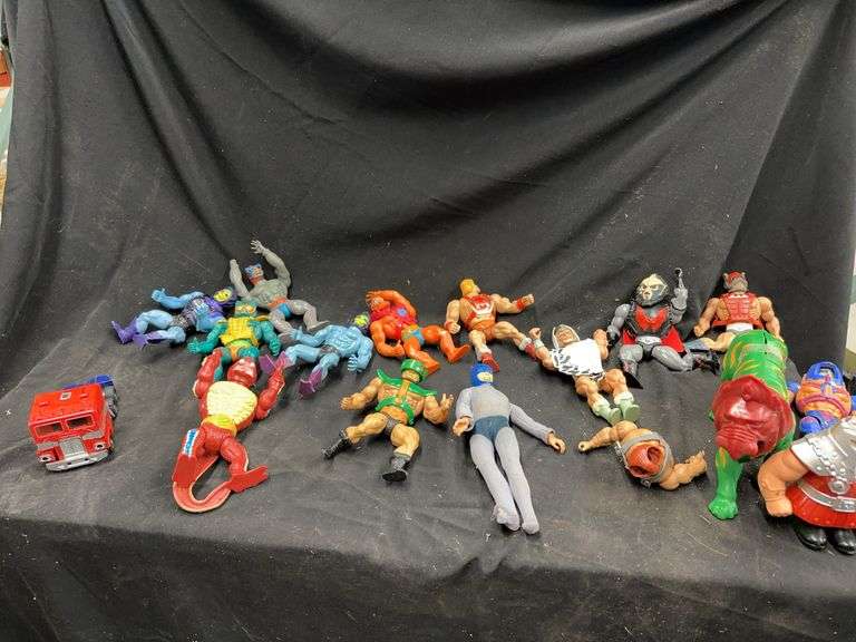 Group of Masters of the Universe MOTU Figures and Optimus Prime Toy image