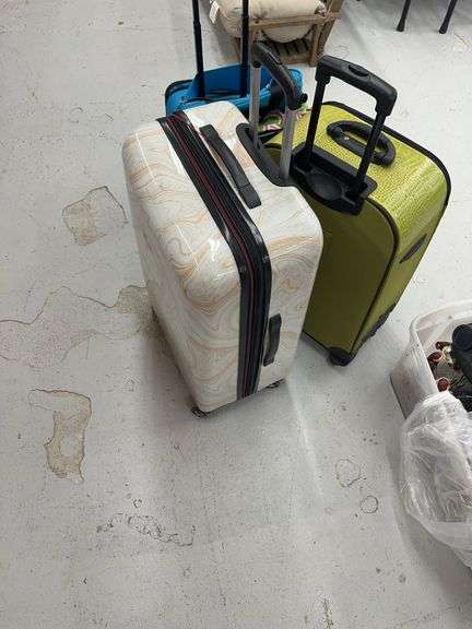Three Assorted Rolling Suitcases image
