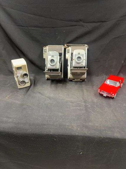 Two Polaroid Land Cameras, Tower 8mm Movie Camera, and Mustang Model Car image