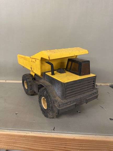 Yellow and Black Toy Dump Truck image