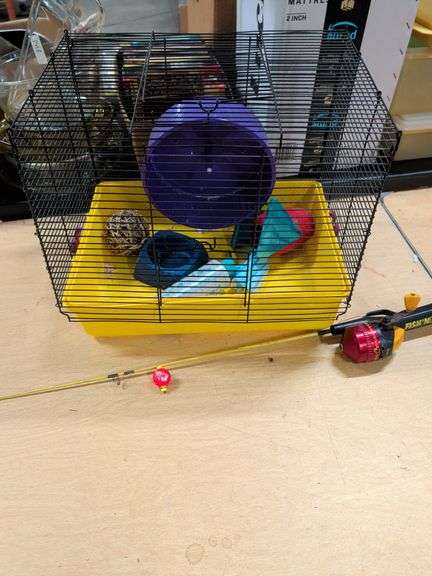 HAMSTER CAGE AND CHILD'S FISHING POLE image