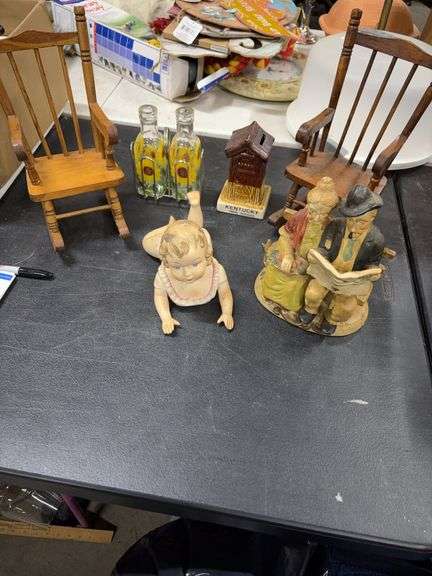 CERAMIC FIGURES- SMALL WOOD ROCKING CHAIRS FOR DOLLS- OUTHOUSE PIGGY BANK- VINEGAR CRUETS IN A METAL CARRIER- image