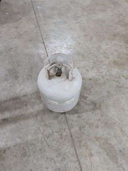 PROPANE TANK FEELS ABOUT HALF FULL image
