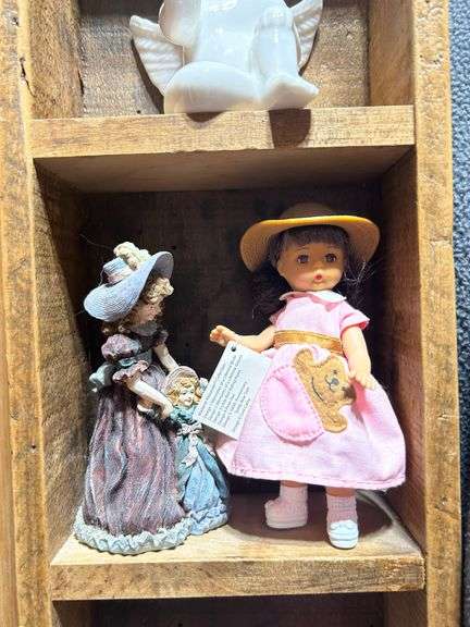Collectible Figurines in Wooden Display Case