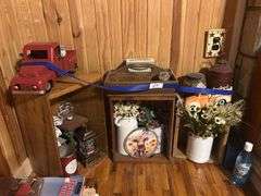 Rustic Home Decor Assortment with Toy Trucks, Floral Accents, and Candles